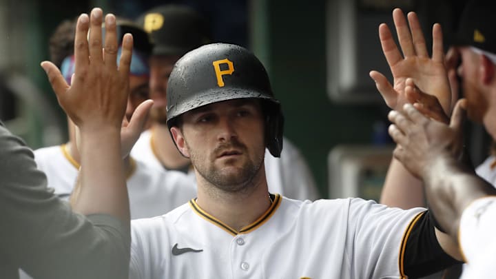 Aug 10, 2023; Pittsburgh, Pennsylvania, USA; Pittsburgh Pirates catcher Jason Delay (55) high-fives in the dugout after scoring a run against the Atlanta Braves during the third inning at PNC Park. Mandatory Credit: Charles LeClaire-Imagn Images