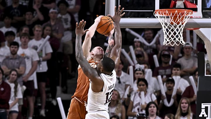 Feb 28, 2026; College Station, Texas, USA; Texas A&M Aggies forward Rashaun Agee (12) fouls Texas Longhorns guard Chendall Weaver (2) during the second half at Reed Arena. Mandatory Credit: Maria Lysaker-Imagn Images 