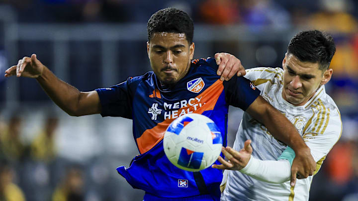 FC Cincinnati midfielder Evander, left, battles for the ball against Tigres UANL defender Jesus Angulo in the first half at TQL Stadium. Mandatory Credit: Katie Stratman-Imagn Images