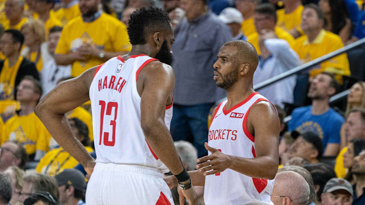 April 30, 2019; Oakland, CA, USA; Houston Rockets guard James Harden (13) talks to guard Chris Paul (3) during the third quarter in game two of the second round of the 2019 NBA Playoffs against the Golden State Warriors at Oracle Arena. The Warriors defeated the Rockets 115-109. Mandatory Credit: Kyle Terada-Imagn Images