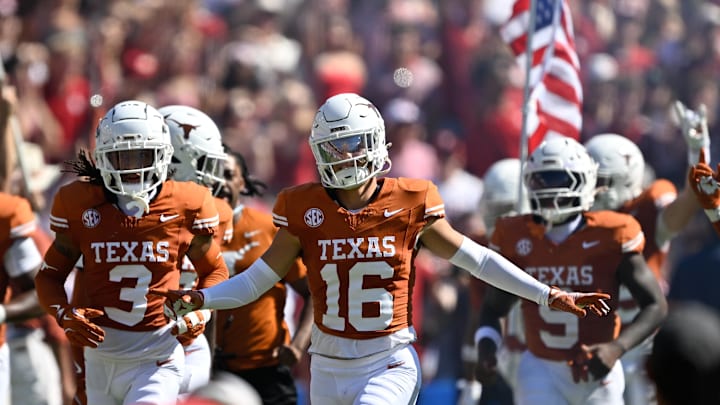 Texas Longhorns defensive back Michael Taaffe leads the team on to the field against the Oklahoma Sooners Texas Longhorns defensive back Michael Taaffe leads the team on to the field against the Oklahoma Sooners
