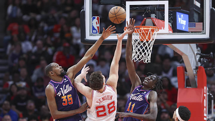 Phoenix Suns forward Kevin Durant and center Bol Bol defend against Houston Rockets center Alperen Sengun on Feb 23, 2024.