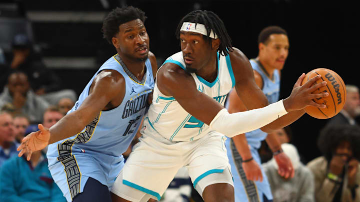 Charlotte Hornets center Mark Williams (5) handles the ball as Memphis Grizzlies forward Jaren Jackson Jr. (13) defends during the third quarter at FedExForum.