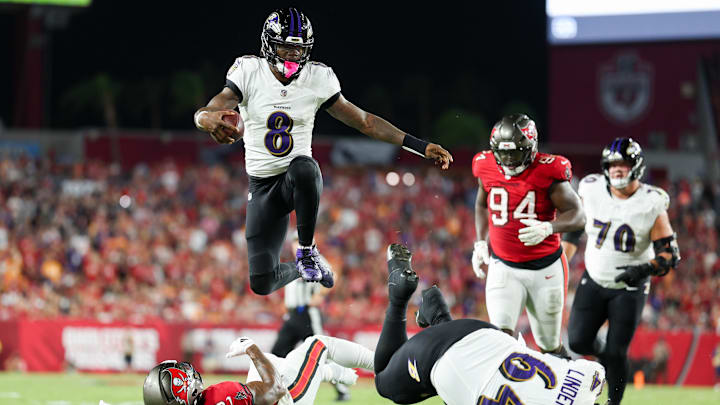 Oct 21, 2024; Tampa, Florida, USA; Baltimore Ravens quarterback Lamar Jackson (8) runs with the ball against the Tampa Bay Buccaneers in the second quarter at Raymond James Stadium. Mandatory Credit: Nathan Ray Seebeck-Imagn Images