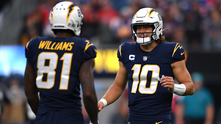 Los Angeles Chargers quarterback Justin Herbert talks to wide receiver Mike Williams Los Angeles Chargers quarterback Justin Herbert talks to wide receiver Mike Williams