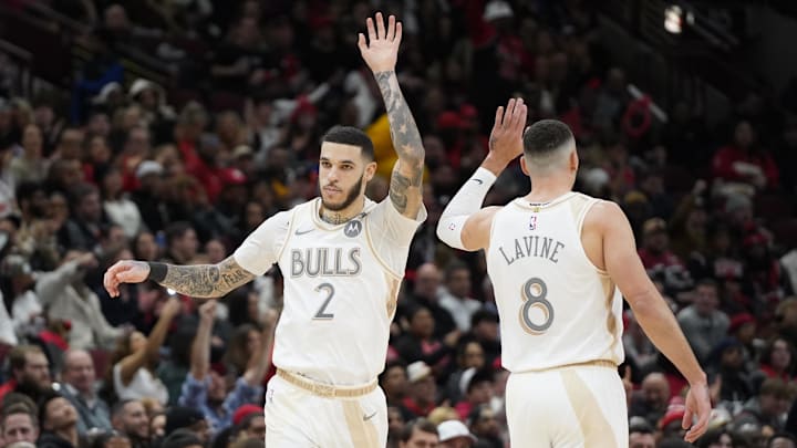 Jan 4, 2025; Chicago, Illinois, USA; Chicago Bulls guard Lonzo Ball (2) high fives guard Zach LaVine (8) after making a three point basket against the New York Knicks during the second half at United Center. Mandatory Credit: David Banks-Imagn Images