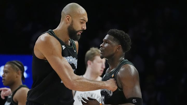 Dec 27, 2025; Minneapolis, Minnesota, USA; Minnesota Timberwolves center Rudy Gobert (27) congratulates guard Anthony Edwards (5) on his basket against the Brooklyn Nets in the first quarter at Target Center. Mandatory Credit: Bruce Kluckhohn-Imagn Images