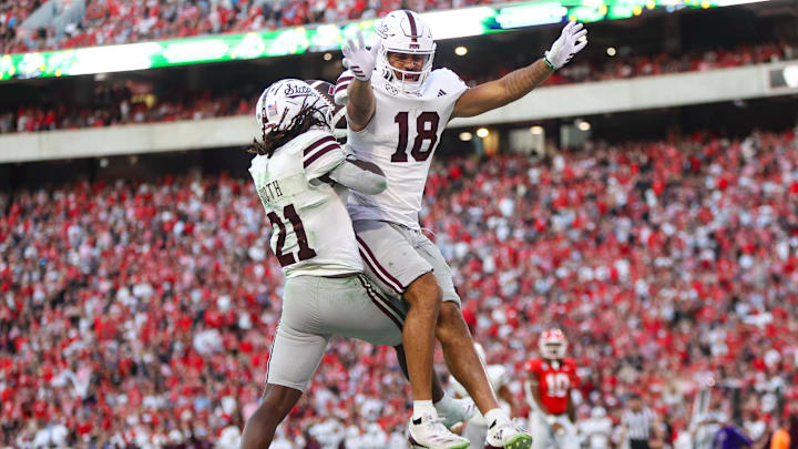 Oct 12, 2024; Athens, Georgia, USA; Mississippi State Bulldogs running back Davon Booth (21) celebrates after a touchdown with tight end Seydou Traore (18) against the Georgia Bulldogs in the third quarter at Sanford Stadium. Mandatory Credit: Brett Davis-Imagn Images