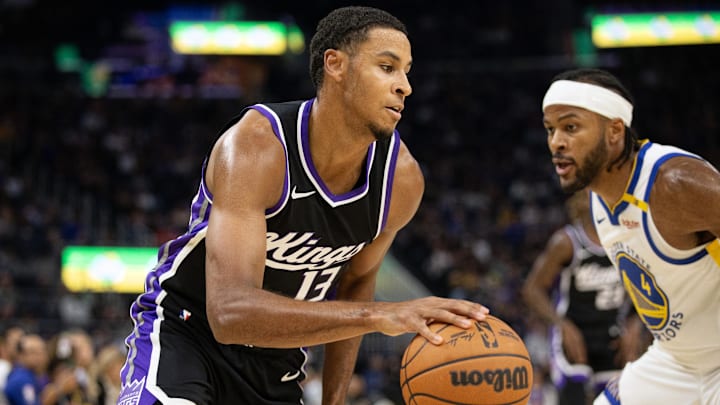 Oct 11, 2024; San Francisco, California, USA; Sacramento Kings forward Keegan Murray (13) drives past Golden State Warriors guard Moses Moody (4) during the first quarter at Chase Center. Mandatory Credit: D. Ross Cameron-Imagn Images