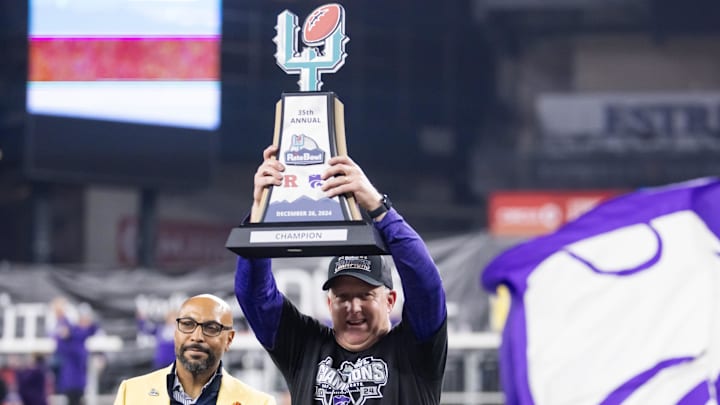 Dec 26, 2024; Phoenix, AZ, USA; Kansas State Wildcats head coach Chris Klieman celebrates with the trophy after defeating the Rutgers Scarlet Knights during the Rate Bowl at Chase Field. Mandatory Credit: Mark J. Rebilas-Imagn Images Dec 26, 2024; Phoenix, AZ, USA; Kansas State Wildcats head coach Chris Klieman celebrates with the trophy after defeating the Rutgers Scarlet Knights during the Rate Bowl at Chase Field. Mandatory Credit: Mark J. Rebilas-Imagn Images