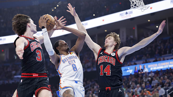 Mar 31, 2025; Oklahoma City, Oklahoma, USA; Oklahoma City Thunder forward Jalen Williams (8) drives between Chicago Bulls guard Josh Giddey (3) and forward Matas Buzelis (14) during the first quarter at Paycom Center. Mandatory Credit: Alonzo Adams-Imagn Images