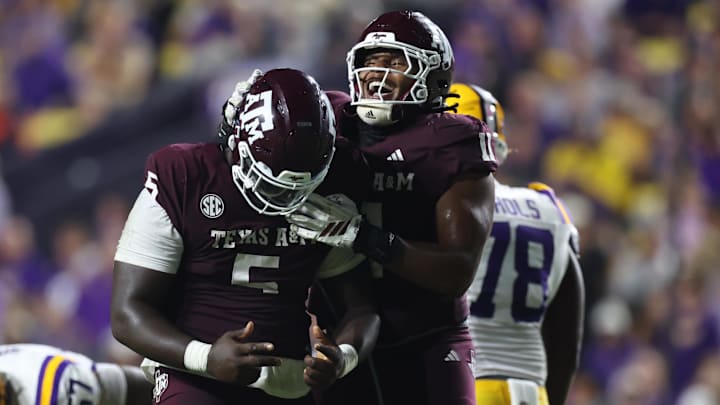 Texas A&M Aggies defensive tackle DJ Hicks celebrates with defensive tackle Tyler Onyedim after a play during the second half against the Louisiana State Tigers at Tiger Stadium. Texas A&M Aggies defensive tackle DJ Hicks celebrates with defensive tackle Tyler Onyedim after a play during the second half against the Louisiana State Tigers at Tiger Stadium.