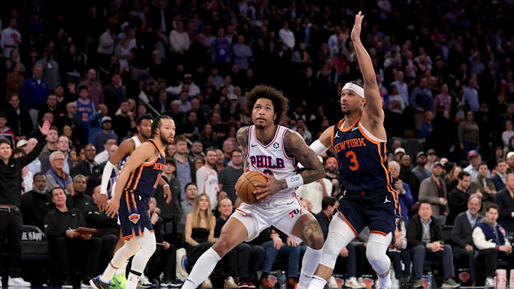 Feb 26, 2025; New York, New York, USA; Philadelphia 76ers guard Kelly Oubre Jr. (9) drives to the basket against New York Knicks guards Josh Hart (3) and Jalen Brunson (11) during the fourth quarter at Madison Square Garden. Mandatory Credit: Brad Penner-Imagn Images Feb 26, 2025; New York, New York, USA; Philadelphia 76ers guard Kelly Oubre Jr. (9) drives to the basket against New York Knicks guards Josh Hart (3) and Jalen Brunson (11) during the fourth quarter at Madison Square Garden. Mandatory Credit: Brad Penner-Imagn Images