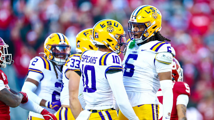 Louisiana State Tigers safety Dashawn Spears celebrates with Louisiana State Tigers defensive end Patrick Payton first half against the Oklahoma Sooners at Gaylord Family-Oklahoma Memorial Stadium. 