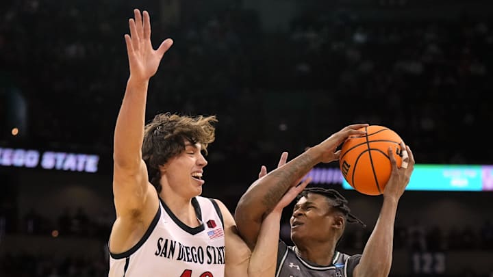 Mar 22, 2024; Spokane, WA, USA; UAB Blazers forward Christian Coleman (13) drives to the basket against San Diego State Aztecs forward Miles Heide (40) during the first half in the first round of the 2024 NCAA Tournament at Spokane Veterans Memorial Arena. Mandatory Credit: Kirby Lee-Imagn Images 