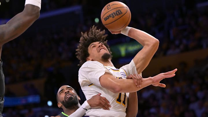 Los Angeles Lakers center Jaxson Hayes (11) is fouled by Minnesota Timberwolves guard Mike Conley (10) in the first half at Crypto.com Arena.