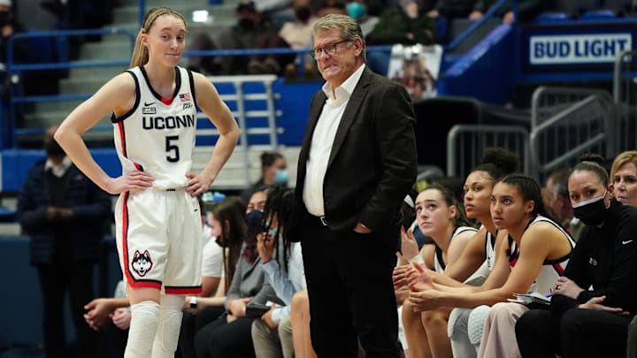 Feb 25, 2022; Hartford, Connecticut, USA; UConn Huskies head coach Geno Auriemma talks with guard Paige Bueckers (5) from the sideline as they take on the St. John's Red Storm in the second half at XL Center. Mandatory Credit: David Butler II-Imagn Images Feb 25, 2022; Hartford, Connecticut, USA; UConn Huskies head coach Geno Auriemma talks with guard Paige Bueckers (5) from the sideline as they take on the St. John's Red Storm in the second half at XL Center. Mandatory Credit: David Butler II-Imagn Images