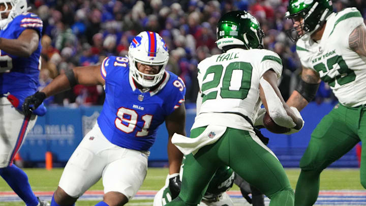 Nov 19, 2023; Orchard Park, New York, USA; Buffalo Bills defensive tackle Ed Oliver (91) pursues New York Jets running back Breece Hall (20)