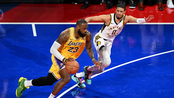 Dec 9, 2023; Las Vegas, Nevada, USA; Los Angeles Lakers forward LeBron James (23) dribbles against Indiana Pacers guard Tyrese Haliburton (0) during the fourth quarter of the NBA In-Season Tournament Championship game at T-Mobile Arena. Mandatory Credit: Candice Ward-Imagn Images