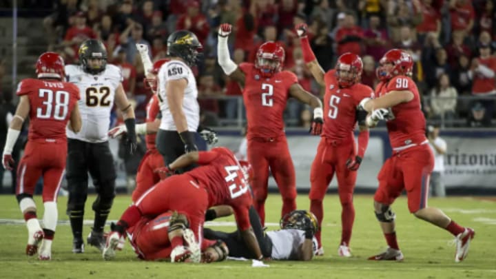 Marquis Flowers celebrating a tackle made by Justin Washington. Marquis Flowers celebrating a tackle made by Justin Washington.