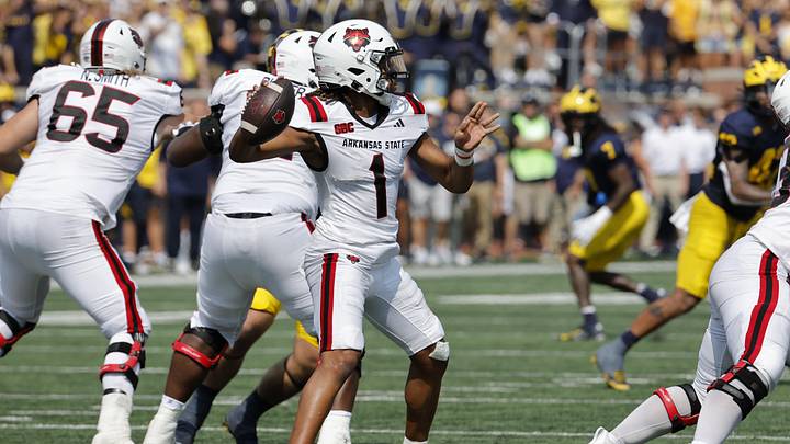 Sep 14, 2024; Ann Arbor, Michigan, USA; Arkansas State Red Wolves quarterback Jaylen Raynor (1) throws against the Michigan Wolverines during the first half at Michigan Stadium. Mandatory Credit: Rick Osentoski-Imagn Images Sep 14, 2024; Ann Arbor, Michigan, USA; Arkansas State Red Wolves quarterback Jaylen Raynor (1) throws against the Michigan Wolverines during the first half at Michigan Stadium. Mandatory Credit: Rick Osentoski-Imagn Images