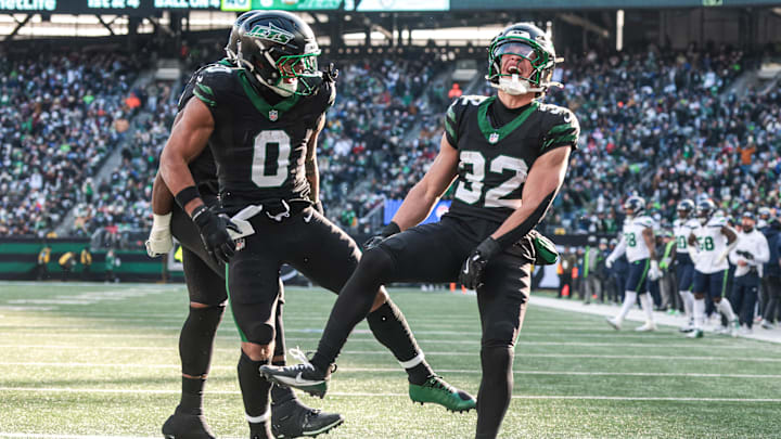 Dec 1, 2024; East Rutherford, New Jersey, USA; New York Jets running back Isaiah Davis (32) celebrates his rushing touchdown during the first quarter with running back Braelon Allen (0) against the Seattle Seahawks at MetLife Stadium.