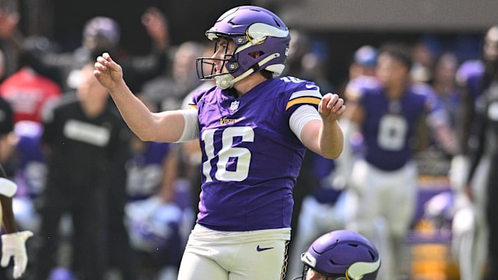 Sep 15, 2024; Minneapolis, Minnesota, USA; Minnesota Vikings place kicker Will Reichard (16) kicks a field goal as punter Ryan Wright (17) looks on during the second quarter against the San Francisco 49ers U.S. Bank Stadium.