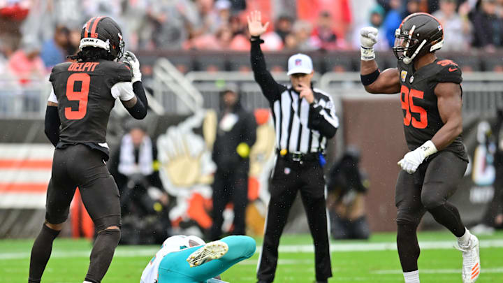 Oct 19, 2025; Cleveland, Ohio, USA; Cleveland Browns safety Grant Delpit (9) and defensive end Myles Garrett (95) celebrates after Delpit sacked Miami Dolphins quarterback Tua Tagovailoa (1) during the first half at Huntington Bank Field. Mandatory Credit: Ken Blaze-Imagn Images
