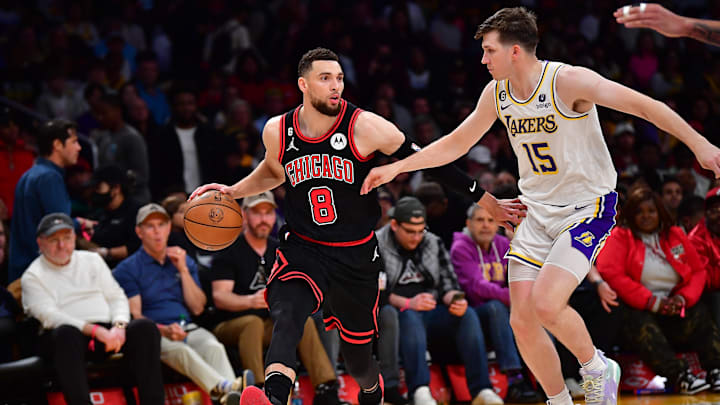 Mar 26, 2023; Los Angeles, California, USA; Chicago Bulls guard Zach LaVine (8) moves the ball up court against Los Angeles Lakers guard Austin Reaves (15) during the second half at Crypto.com Arena. Mandatory Credit: Gary A. Vasquez-Imagn Images