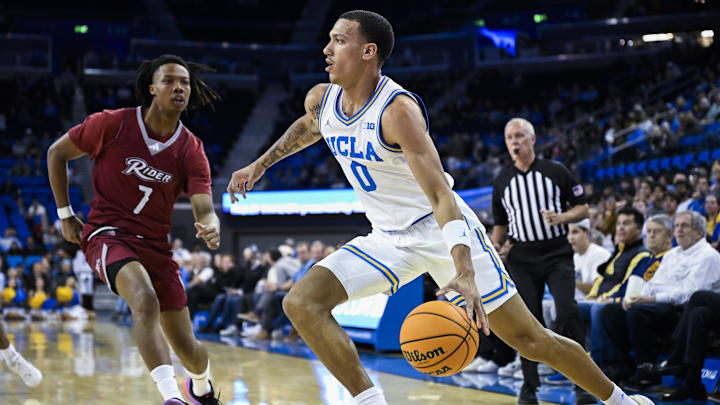 Nov 4, 2024; Los Angeles, California, USA; UCLA Bruins guard Kobe Johnson (0) drives the baseline past Rider Broncs forward Ife West-Ingram (7) during the second half at Pauley Pavilion presented by Wescom. Mandatory Credit: Robert Hanashiro-Imagn Images Nov 4, 2024; Los Angeles, California, USA; UCLA Bruins guard Kobe Johnson (0) drives the baseline past Rider Broncs forward Ife West-Ingram (7) during the second half at Pauley Pavilion presented by Wescom. Mandatory Credit: Robert Hanashiro-Imagn Images
