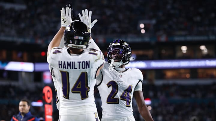 Oct 30, 2025; Miami Gardens, Florida, USA; Baltimore Ravens safety Kyle Hamilton (14) and safety Malaki Starks (24) react after a play during the second quarter against the Miami Dolphins at Hard Rock Stadium. Mandatory Credit: Nathan Ray Seebeck-Imagn Images
