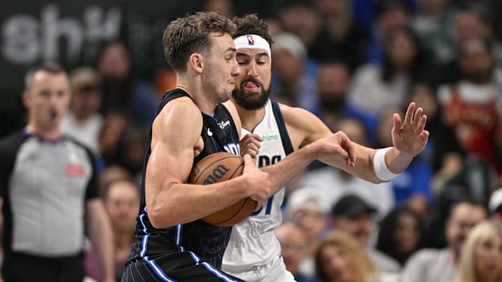Orlando Magic forward Franz Wagner (22) moves to the basket past Dallas Mavericks guard Klay Thompson (31) during the second quarter at the American Airlines Center.