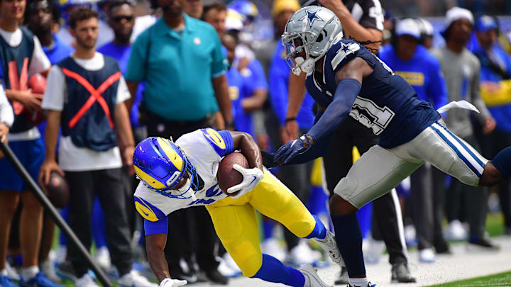 Los Angeles Rams wide receiver Xavier Smith is pushed out of bounds by Dallas Cowboys cornerback Caelen Carson. Los Angeles Rams wide receiver Xavier Smith is pushed out of bounds by Dallas Cowboys cornerback Caelen Carson.