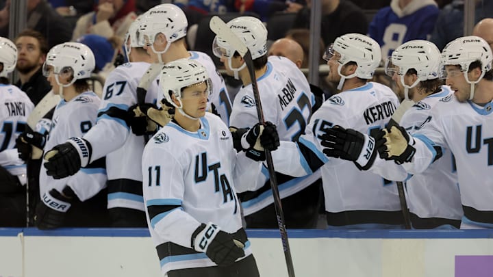 Jan 5, 2026; New York, New York, USA; Utah Mammoth right wing Dylan Guenther (11) celebrates his goal against the New York Rangers with teammates during the second period at Madison Square Garden. Mandatory Credit: Brad Penner-Imagn Images