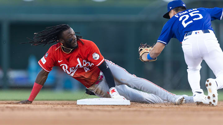 Mar 4, 2025; Phoenix, Arizona, USA; Cincinnati Reds shortstop Elly De La Cruz steals second base ahead of the tag by Los Angeles Dodgers second baseman Tommy Edman during a spring training game at Camelback Ranch-Glendale. Mandatory Credit: Mark J. Rebilas-Imagn Images