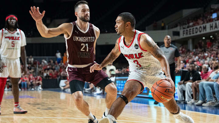 The Ville's Peyton Siva (3) makes his way to the basket around UKnighted's Vance Hall (21) during their game on Saturday, July 20, 2024 in Louisville, Ky. at Freedom Hall during the first round of The Basketball Tournament.