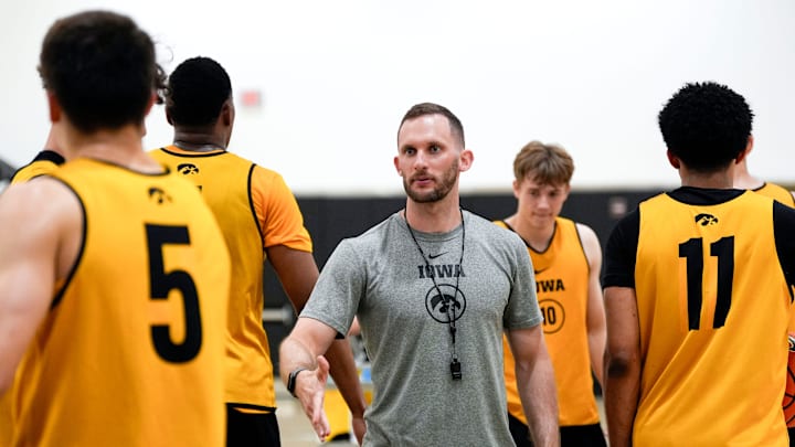 Iowa men’s basketball assistant coach Connor Wheeler high-fives players during practice June 19, 2025 at Carver-Hawkeye Arena in Iowa City, Iowa. Iowa men’s basketball assistant coach Connor Wheeler high-fives players during practice June 19, 2025 at Carver-Hawkeye Arena in Iowa City, Iowa.