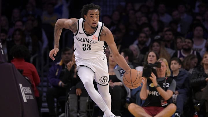 Jan 17, 2025; Los Angeles, California, USA;  Brooklyn Nets center Nic Claxton (33) handles the ball against the Los Angeles Lakers at Crypto.com Arena. Mandatory Credit: Jayne Kamin-Oncea-Imagn Images
