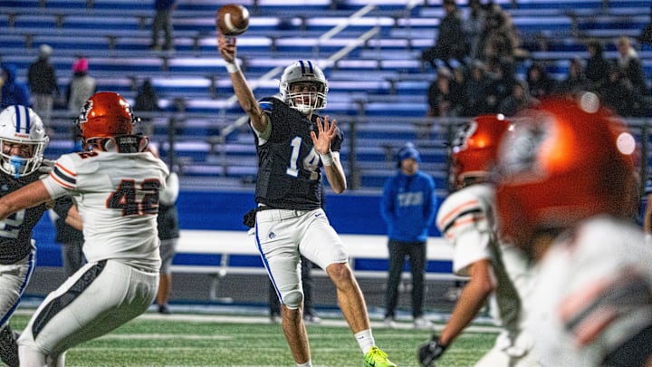 Waukee Northwest's Mack Heitland attempts a pass during 5A playoff football game at Waukee Northwest High School on Friday, Nov. 7, 2025, in Waukee.