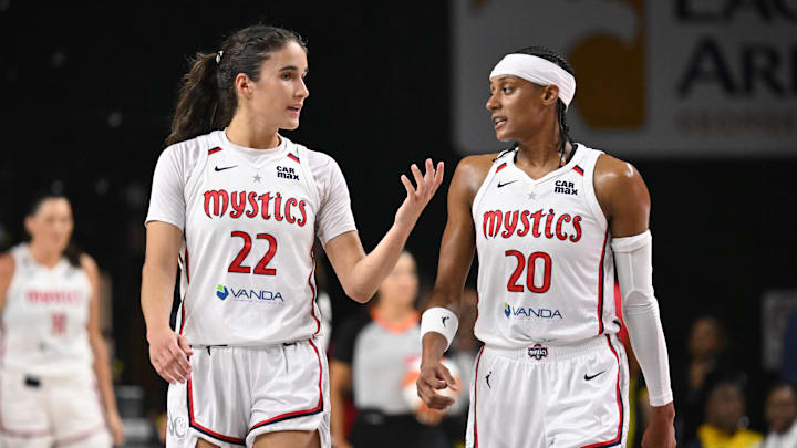 Washington Mystics guard Sonia Citron (22) chats with guard Brittney Sykes (20) after a time out against the Las Vegas Aces during the second quarter at EagleBank Arena.