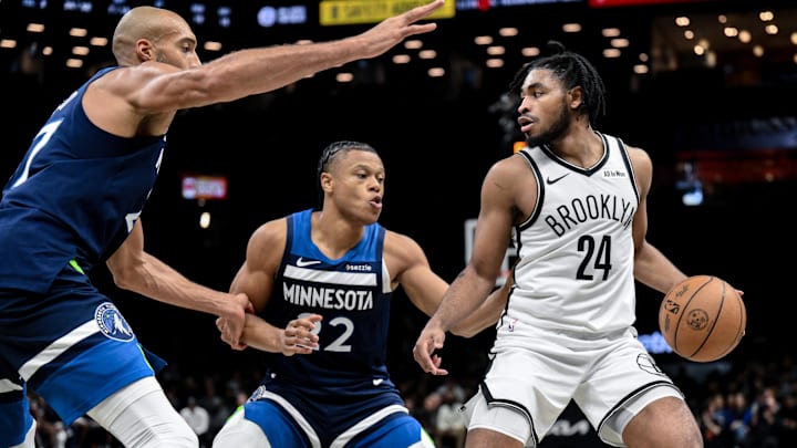 Nov 3, 2025; Brooklyn, New York, USA; Brooklyn Nets guard Cam Thomas (24) tries to drive past Minnesota Timberwolves center Rudy Gobert (27) and guard Jaylen Clark (22) during the second half at Barclays Center. Mandatory Credit: John Jones-Imagn Images
