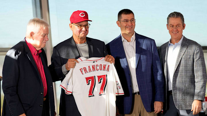 New Cincinnati Reds manager Terry Francona holds his new jersey on stage with (left to right) team owner Bob Castellini, President of Baseball Operation, Nick Krall, and General Manager Brad Meador, during an event to introduce the new manager of the Cincinnati Reds at Great American Ball Park in downtown Cincinnati on Monday, Oct. 7, 2024.