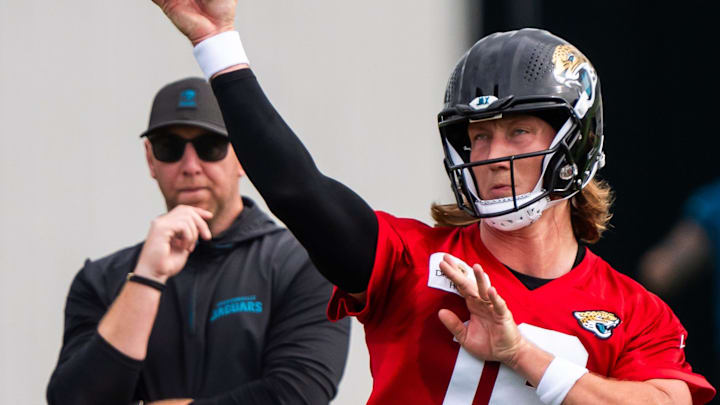 Jacksonville Jaguars quarterback Trevor Lawrence (16) passes as Jacksonville Jaguars head coach Liam Coen watches during the Jacksonville Jaguars’ mandatory minicamp Tuesday June 10, 2025 at the Miller Electric Center in Jacksonville, Fla. [Doug Engle/Florida Times-Union]