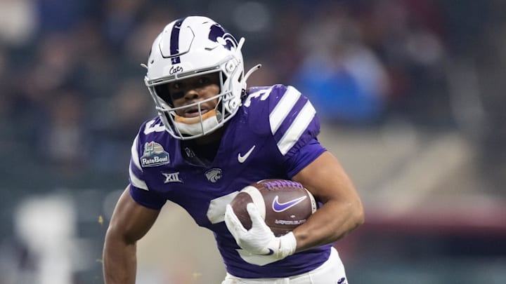 Dec 26, 2024; Phoenix, AZ, USA; Kansas State Wildcats running back Dylan Edwards (3) against the Rutgers Scarlet Knights during the Rate Bowl at Chase Field. Mandatory Credit: Mark J. Rebilas-Imagn Images