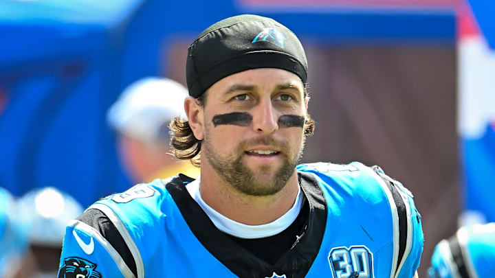 Carolina Panthers receiver Adam Thielen runs onto the field before a game.