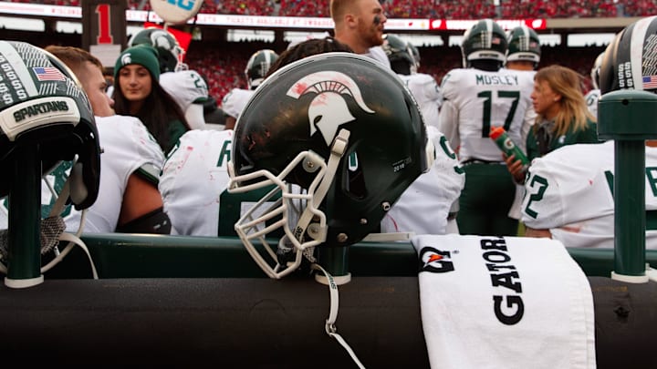 Oct 12, 2019; Madison, WI, USA; Michigan State Spartans helmet on the sidelines during the game against the Wisconsin Badgers at Camp Randall Stadium. Mandatory Credit: Jeff Hanisch-USA TODAY Sports Oct 12, 2019; Madison, WI, USA; Michigan State Spartans helmet on the sidelines during the game against the Wisconsin Badgers at Camp Randall Stadium. Mandatory Credit: Jeff Hanisch-USA TODAY Sports