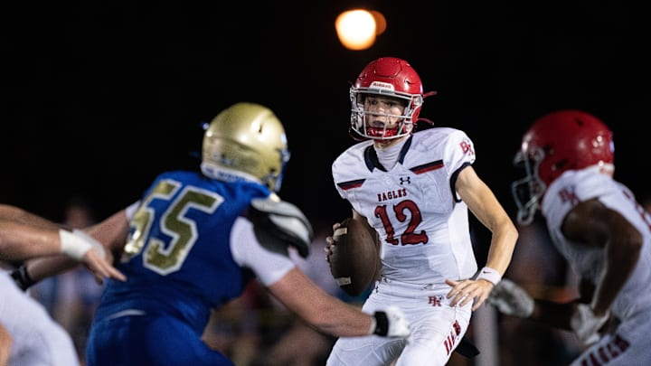 Brentwood Academy's George MacIntyre (12) is pressured by Brentwood's Seth Adams (55) at James C.