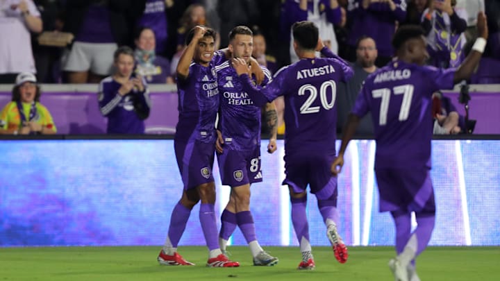 Feb 22, 2025; Orlando, Florida, USA; Orlando City forward Marco Pasalic (87) celebrates with teammates after scoring a goal against the Philadelphia Union in the first half at Inter&Co Stadium. Mandatory Credit: Morgan Tencza-Imagn Images