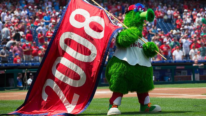 Aug 5, 2018; Philadelphia, PA, USA; Phillie Phanatic holds a flag celebrating the 2008 world champion Philadelphia Phillies before a game against the Miami Marlins at Citizens Bank Park. Mandatory Credit: Bill Streicher-USA TODAY Sports Aug 5, 2018; Philadelphia, PA, USA; Phillie Phanatic holds a flag celebrating the 2008 world champion Philadelphia Phillies before a game against the Miami Marlins at Citizens Bank Park. Mandatory Credit: Bill Streicher-USA TODAY Sports