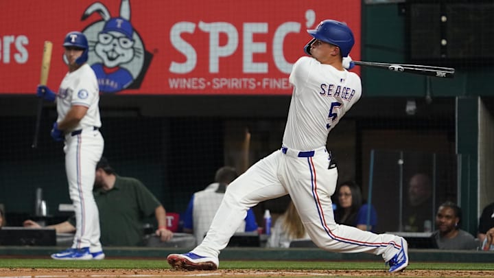 Mar 29, 2025; Arlington, Texas, USA; Texas Rangers shortstop Corey Seager (5) follows through on a single during the fifth inning against the Boston Red Sox at Globe Life Field. Mar 29, 2025; Arlington, Texas, USA; Texas Rangers shortstop Corey Seager (5) follows through on a single during the fifth inning against the Boston Red Sox at Globe Life Field.